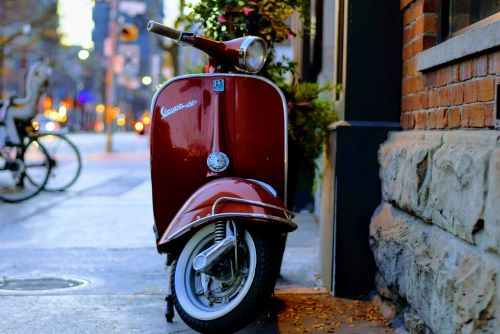 a motorcycle parked on the side of a building